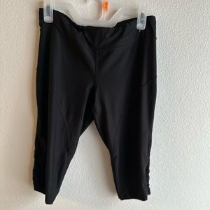 Capri yoga pants with lace cutouts on the side